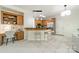 Modern kitchen with breakfast bar, stainless steel appliances, and adjacent office space at 16718 Hampton Crossing Dr, Huntersville, NC 28078