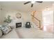 Bright living room featuring a fireplace, staircase, and comfortable seating area at 16718 Hampton Crossing Dr, Huntersville, NC 28078
