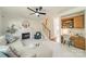 Cozy living room showcases a fireplace, staircase, built-in desk and shelving at 16718 Hampton Crossing Dr, Huntersville, NC 28078
