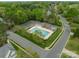 Aerial view of a community pool surrounded by lush trees and manicured landscaping, offering a relaxing recreation space at 16718 Hampton Crossing Dr, Huntersville, NC 28078