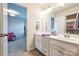 Clean bathroom with an open view into the bedroom, featuring a single vanity at 17712 Yarwill Ct, Charlotte, NC 28278