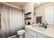 Bathroom with a shower/tub combo, and a vanity providing storage space and functionality at 17712 Yarwill Ct, Charlotte, NC 28278