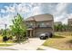 Beautiful two-story brick home with a driveway, two-car garage, and lush landscaping at 17712 Yarwill Ct, Charlotte, NC 28278