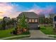 Charming two-story brick home with a well-manicured lawn and attached two-car garage at 17712 Yarwill Ct, Charlotte, NC 28278