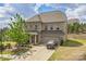 Beautiful two-story brick home with a driveway, two-car garage, and lush landscaping at 17712 Yarwill Ct, Charlotte, NC 28278