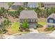 Two-story brick home with manicured lawn, landscaping, and a two-car garage at 17712 Yarwill Ct, Charlotte, NC 28278
