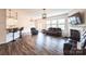 Living room with hardwood floors, fireplace, and French doors to backyard patio at 17712 Yarwill Ct, Charlotte, NC 28278