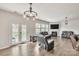 Living room with hardwood floors, fireplace, and French doors to the backyard at 17712 Yarwill Ct, Charlotte, NC 28278