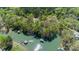 Breathtaking aerial view of docks on a lake with dense surrounding foliage at 179 Abington Ln, Troutman, NC 28166