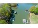Scenic aerial view of a lake with multiple docks and covered boat slips at 179 Abington Ln, Troutman, NC 28166