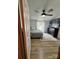 Cozy bedroom features a ceiling fan, a TV, and a neutral color scheme, creating a relaxing retreat at 179 Abington Ln, Troutman, NC 28166