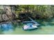 A boat is docked at a modern pier, ready for lake adventures and waterfront living at 179 Abington Ln, Troutman, NC 28166