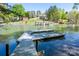 Beautiful lakefront property with a dock and gazebo offering picturesque water views, ideal for serene living and recreation at 179 Abington Ln, Troutman, NC 28166
