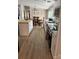 The updated kitchen features an island, white cabinetry, and a view into the dining area for easy entertaining at 179 Abington Ln, Troutman, NC 28166