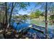 Stunning lake view featuring a private dock and lush greenery, idyllic setting at 179 Abington Ln, Troutman, NC 28166