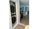 Convenient laundry area with stacked washer and dryer, adjacent to the kitchen, maximizing space and functionality at 179 Abington Ln, Troutman, NC 28166