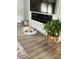 Cozy living room featuring modern fireplace, hardwood flooring, and a comfortable pet bed at 179 Abington Ln, Troutman, NC 28166