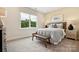 Bright bedroom with a plush carpet, large window with natural light and a bench at 217 Halemarg Dr, Belmont, NC 28012