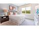 Charming bedroom features a cozy bed, stylish lamps, and a large window with a scenic outdoor view at 217 Halemarg Dr, Belmont, NC 28012