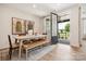 Bright dining area with a modern table, bench seating, and easy access to the outdoor patio at 217 Halemarg Dr, Belmont, NC 28012