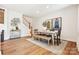 Inviting dining space next to the staircase showcases a table, bench seating, and stylish decor at 217 Halemarg Dr, Belmont, NC 28012