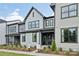 Attractive new construction home boasts a stylish facade with a covered entry and well-manicured landscaping at 217 Halemarg Dr, Belmont, NC 28012