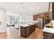 Open kitchen and living area features stainless steel appliances and a large kitchen island at 217 Halemarg Dr, Belmont, NC 28012