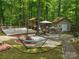 Spacious backyard featuring a deck, shed, hammock and swing set at 2206 Golden Larch Ln, Waxhaw, NC 28173