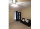 Bedroom featuring a futon couch, dark curtains, and neutral colored walls at 2206 Golden Larch Ln, Waxhaw, NC 28173