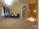 Bonus room featuring carpet flooring and natural light at 2206 Golden Larch Ln, Waxhaw, NC 28173
