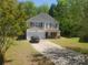 Charming two-story home featuring a two-car garage, well-maintained lawn, and inviting curb appeal at 2206 Golden Larch Ln, Waxhaw, NC 28173