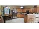 Functional kitchen featuring tiled countertops, wood cabinets, and modern stainless steel appliances at 2206 Golden Larch Ln, Waxhaw, NC 28173