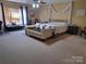 Spacious bedroom featuring large windows, carpet, and modern decor at 2206 Golden Larch Ln, Waxhaw, NC 28173
