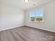 Bedroom featuring hardwood floors and large window at 2229 Camber Dr # Cwo0100, Gastonia, NC 28054