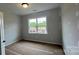 Bright bedroom features a window offering natural light, showcasing the construction phase of the home at 2229 Camber Dr # Cwo0100, Gastonia, NC 28054