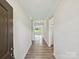 Inviting home hallway with wood flooring and ample natural light leading into the main living areas at 2229 Camber Dr # Cwo0100, Gastonia, NC 28054