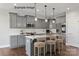 Modern kitchen with gray cabinets, white countertops, stainless steel appliances, and stylish pendant lighting over the island at 2229 Camber Dr # Cwo0100, Gastonia, NC 28054