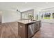 Open-concept kitchen with stainless appliances and a large island with sink at 2229 Camber Dr # Cwo0100, Gastonia, NC 28054