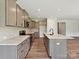 Modern kitchen features a central island, stainless appliances, sleek countertops, and ample cabinet space at 2229 Camber Dr # Cwo0100, Gastonia, NC 28054