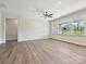 Bright living room with hardwood flooring and large windows showcasing backyard views at 2229 Camber Dr # Cwo0100, Gastonia, NC 28054
