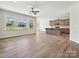 Bright living room and kitchen with hardwood flooring and large windows at 2229 Camber Dr # Cwo0100, Gastonia, NC 28054