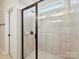 Walk-in shower with tiled walls and glass door at 2229 Camber Dr # Cwo0100, Gastonia, NC 28054