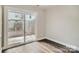 Bedroom with sliding glass door to patio with a hardwood floor and neutral paint at 2335 Brookview Ct, Rock Hill, SC 29732