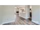 Open living space with living room and kitchen areas, hardwood flooring, and neutral paint at 2335 Brookview Ct, Rock Hill, SC 29732