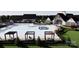 Roselyn community pool and clubhouse, with lounge chairs, tables and lush landscaping at 2807 Morning Song Way, Lancaster, SC 29720
