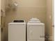 Efficient laundry room with washer, dryer, storage shelf, and easy access at 2807 Morning Song Way, Lancaster, SC 29720
