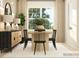 Bright dining room features a wooden table and chairs, complemented by neutral tones and ample natural light at 2820 Morning Song Way, Lancaster, SC 29720