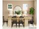 Neutral toned dining room features a wood dining table, modern chairs, and large windows for natural light at 2820 Morning Song Way, Lancaster, SC 29720