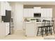 Well-appointed kitchen with stainless steel appliances, a central island and stylish bar stool seating at 2820 Morning Song Way, Lancaster, SC 29720