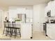 Bright kitchen featuring white cabinets, stainless steel appliances, a central island with seating and modern hardware at 2820 Morning Song Way, Lancaster, SC 29720